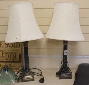 A pair of tall electroplate mounted serpentine Corinthian column table lamps, 83 cm high including