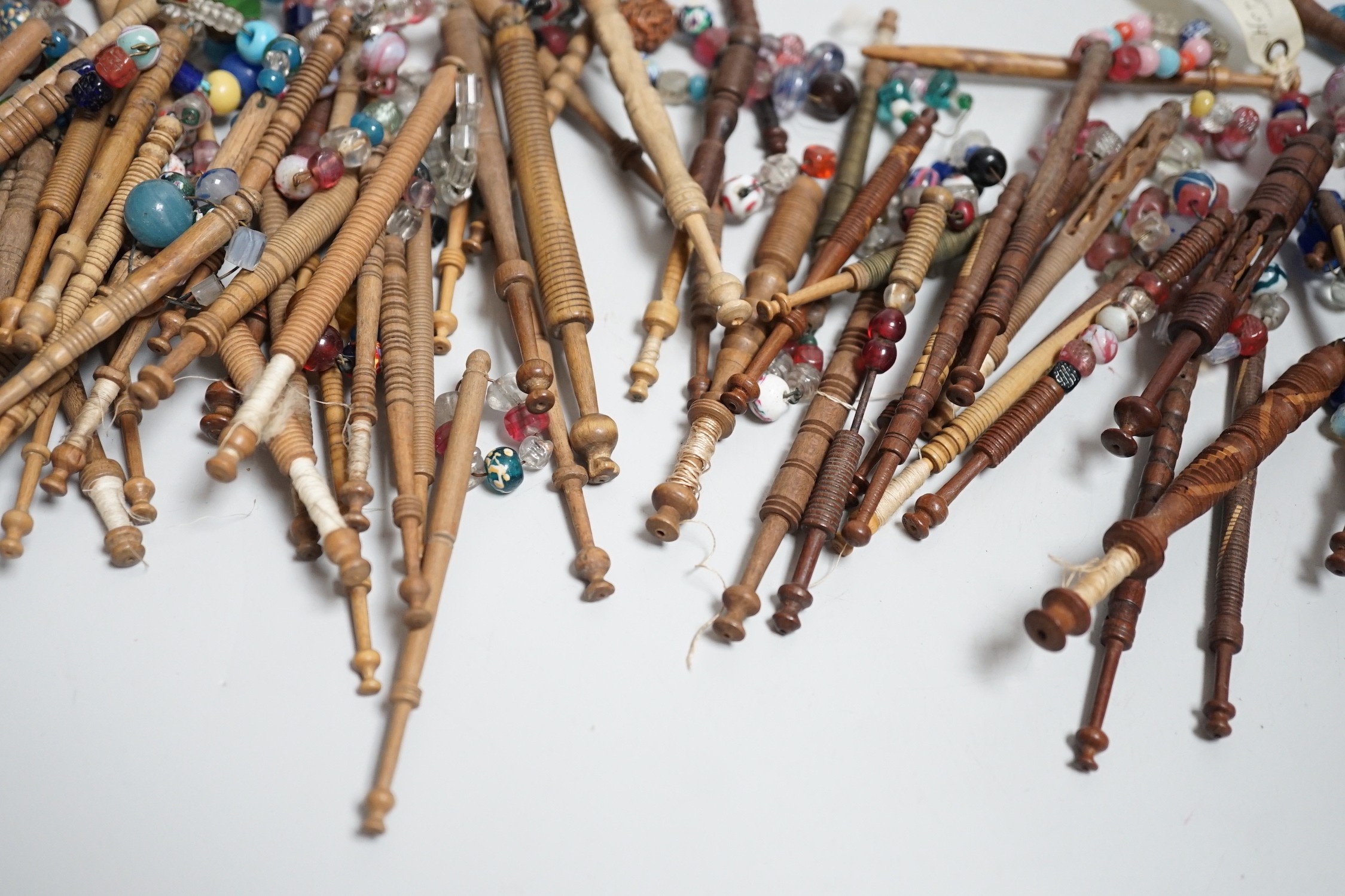 Fifty 19th century finely turned wooden lace bobbins with beaded ends together with 35 ornate wooden - Image 10 of 11