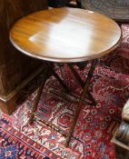 An early 20th century circular beech folding occasional table on faux bamboo underframe, diameter