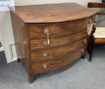 A George III mahogany bowfront dressing chest, with fitted interior, width 106cm, depth 61cm, height