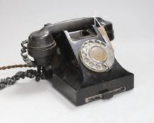 A black Bakelite telephone handset