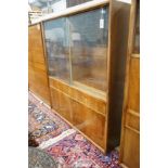 A mid century walnut bookcase by Georg Schoettle, Stuttgart, width 135cm, depth 40cm, height 160cm