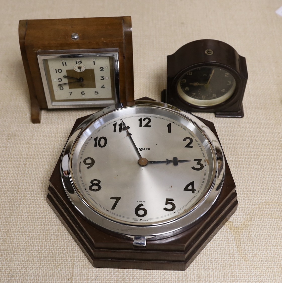 Two Bakelite Art Deco clocks and a DEP clock, largest 24cms high