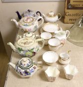 A quantity of tea pots and wares including Doulton, Royal Chelsea, etc.