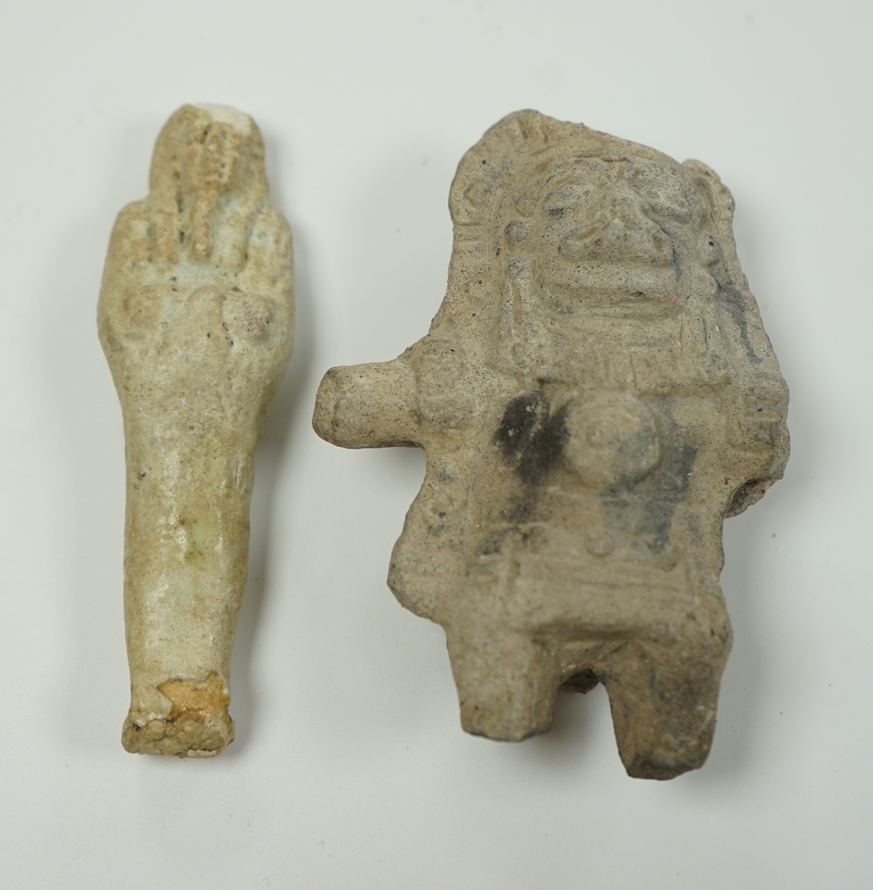 An Egyptian cream faience ushabti and a pre-Columbian pottery figure, 10cm high