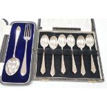 A cased set of six modern silver teaspoons and a cased silver Christening spoon & fork, 4.5oz.