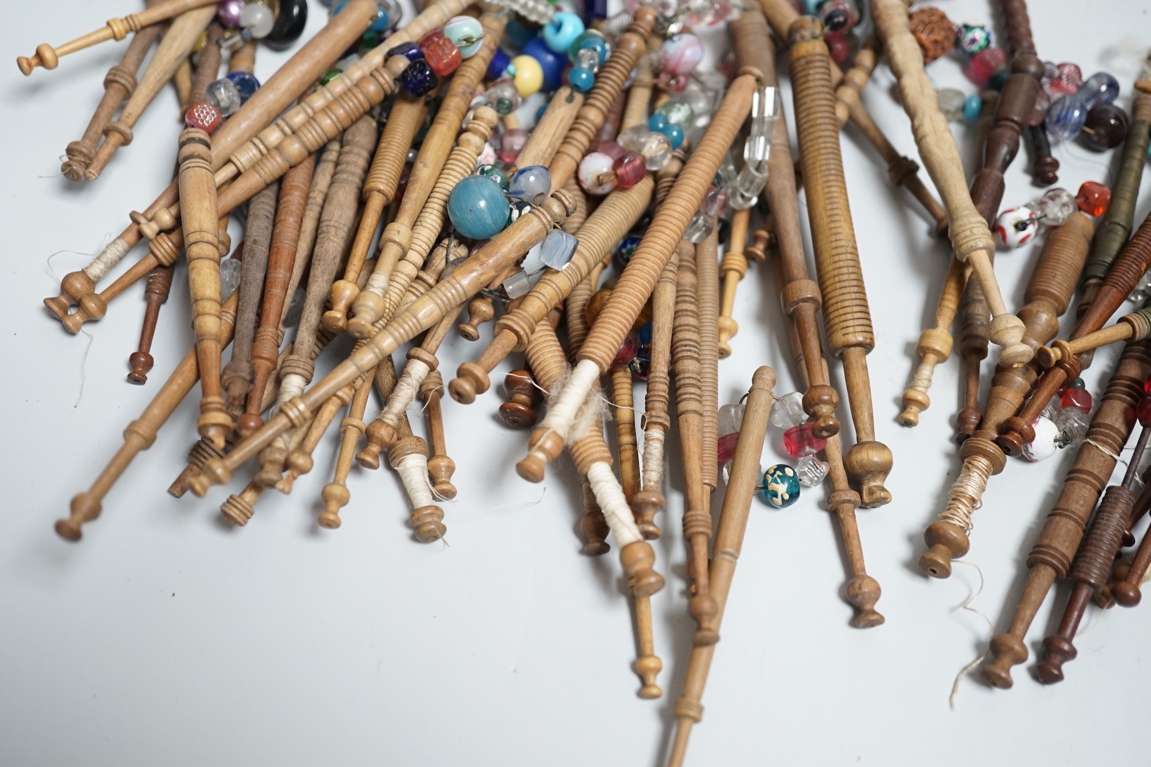 Fifty 19th century finely turned wooden lace bobbins with beaded ends together with 35 ornate wooden - Image 9 of 11