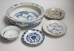 A Chinese blue and white bowl, tea bowl and saucer, and two other dishes, largest 29cm diameter