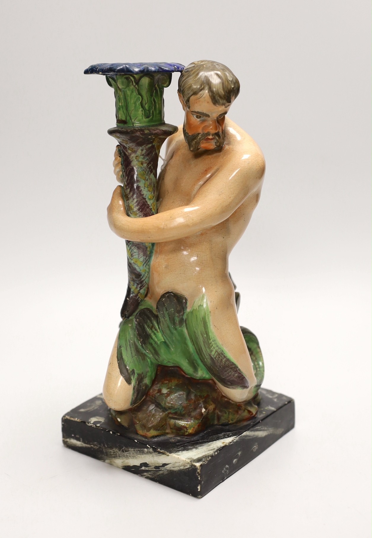 A pearlware ‘Triton’ figural candlestick, attributed to Wood & Caldwell, c.1800, 24cm, after a