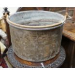 A Victorian brass and wrought iron cauldron with wrought iron swing handle, diameter 56cm, height