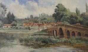 English School, early 20th century, oil on canvas, village scene with bridge, indistinctly signed,