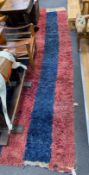 An Afghan wool runner, 400 x 100cm