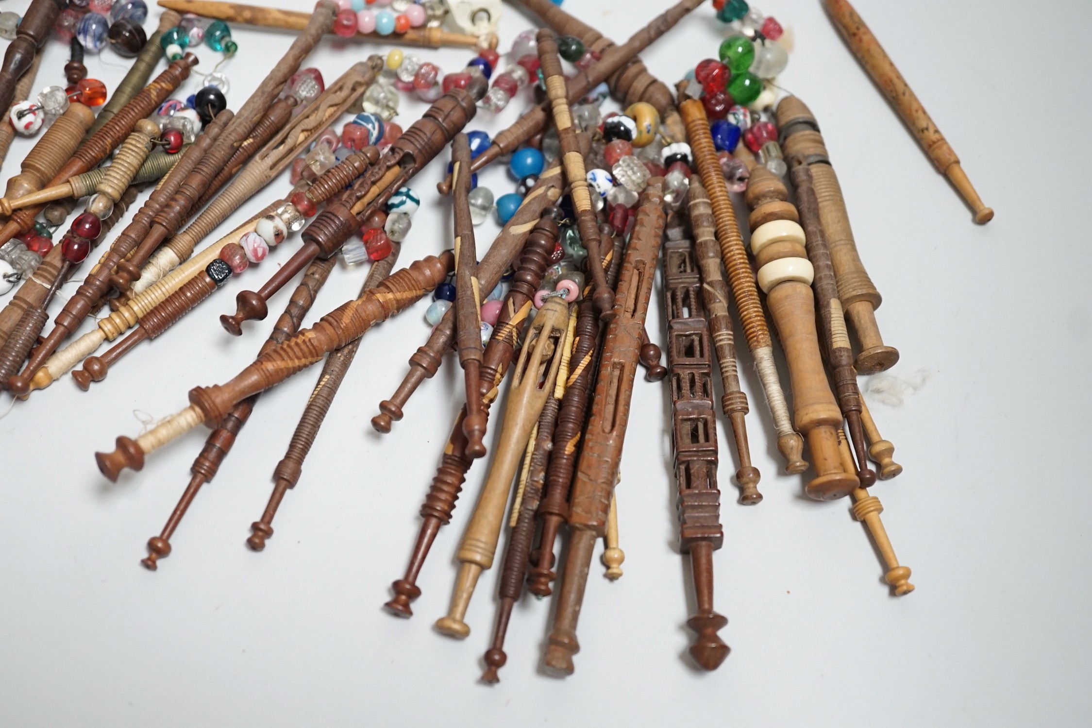 Fifty 19th century finely turned wooden lace bobbins with beaded ends together with 35 ornate wooden - Image 3 of 11