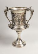 FOOTBALL INTEREST- A late Victorian silver two handled presentation trophy cup, embossed with