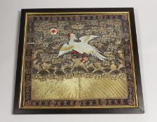 A Chinese silk ornately coloured and gold thread embroidered rank badge, of a Phoenix, 32cms wide