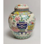 An early 20th century Japanese famille rose jar and cover, 23cms high