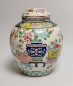An early 20th century Japanese famille rose jar and cover, 23cms high