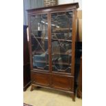 A 1920's Chippendale revival mahogany bookcase, length 115cm, depth 34cm, height 202cm