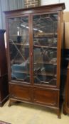 A 1920's Chippendale revival mahogany bookcase, length 115cm, depth 34cm, height 202cm
