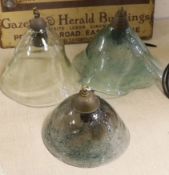 A group of three hand-blown glass light shades