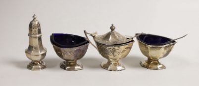 A George V silver four piece condiment set, by Adie Brothers, Birmingham, 1932 and two associated