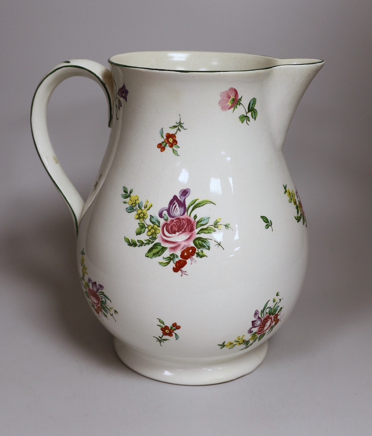 A Pountney jug, commemorating 100 years of the Bristol porcelain factory 1770 -1781, decorated