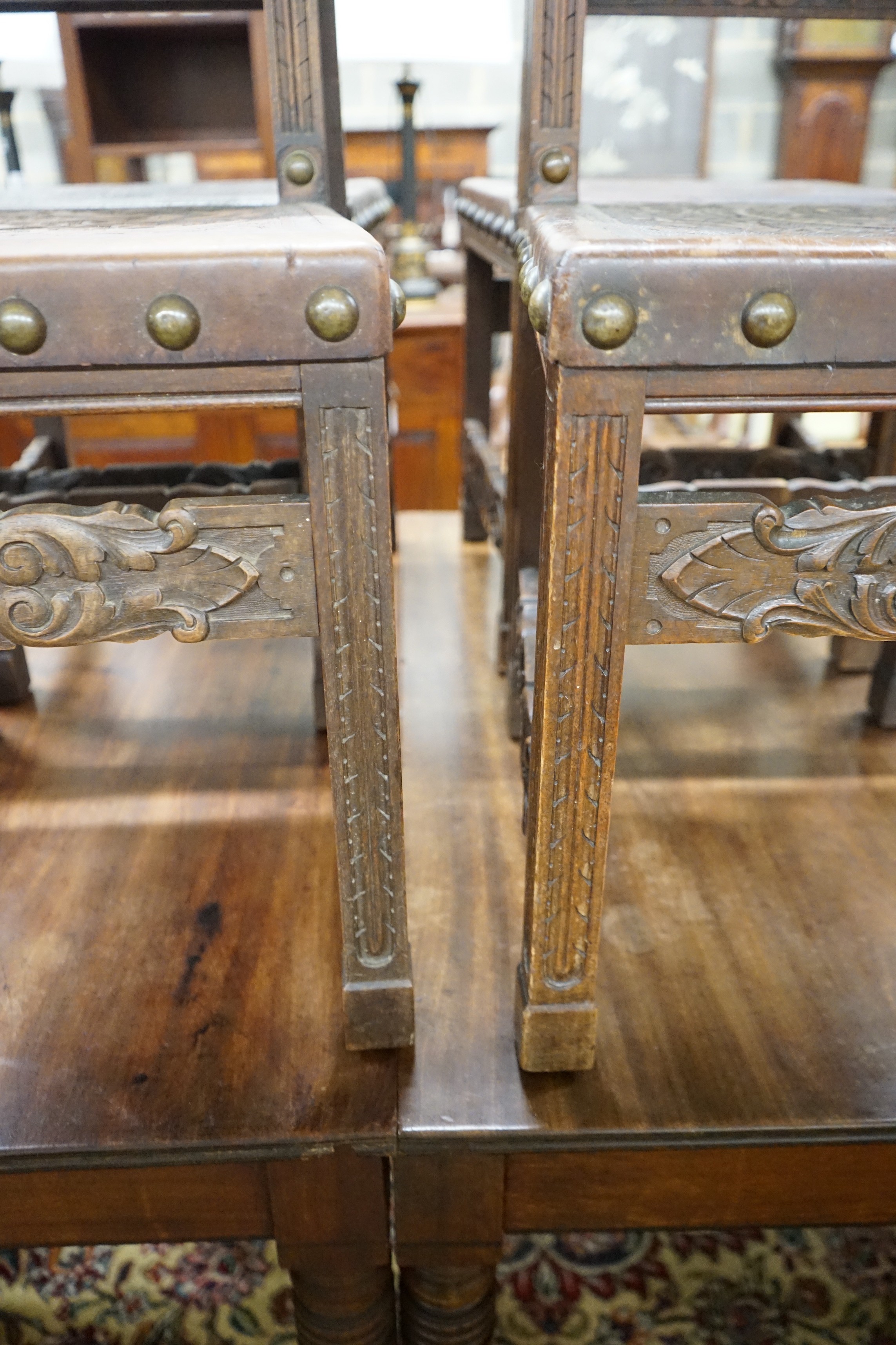 A set of six 18th century style brass studded carved oak and embossed leather dining chairs - Image 4 of 4