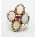 A 1970's 9ct gold, four stone white opal and single stone ruby cluster set dress ring, size O, gross