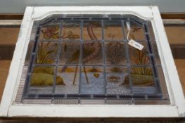 A late Victorian stained leaded glass panel depicting a heron amongst reeds, width 71cm, height
