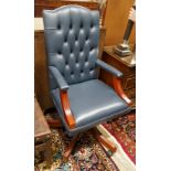 A Regency style mahogany blue buttoned leather swivel desk chair, width 58cm, depth 55cm, height