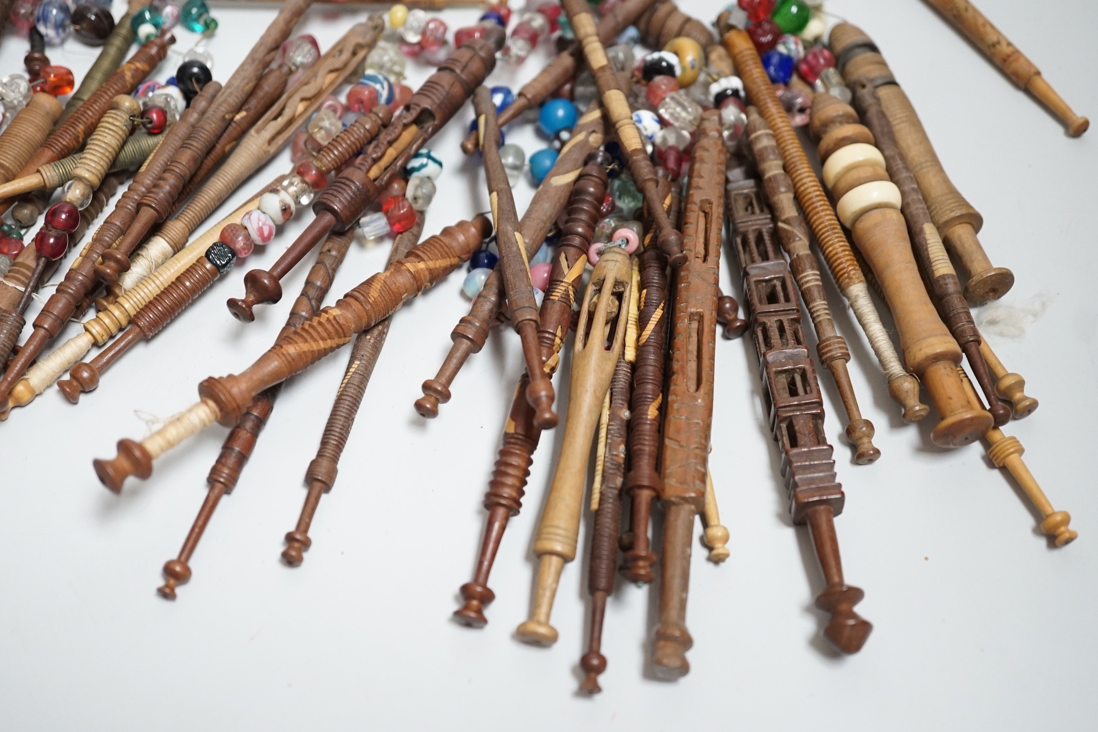 Fifty 19th century finely turned wooden lace bobbins with beaded ends together with 35 ornate wooden - Image 11 of 11