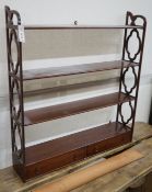 A reproduction George III style mahogany four tier wall bracket, width 81cm, depth 17cm, height