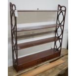 A reproduction George III style mahogany four tier wall bracket, width 81cm, depth 17cm, height