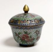 A plique a jour enamel pot and cover, 9cms high