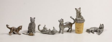 A modern silver miniature free standing model of a cat, with raised paw, London, 1995, length