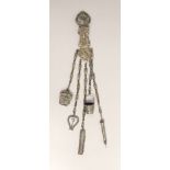 A Victorian white metal chatelaine with five accessories, import maker's mark for B.H. Joseph &