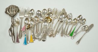 A small collection of assorted silver flatware including teaspoons, enamelled spoons(a.f.), butter