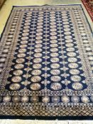 A Bokhara blue ground carpet, 270 x 186cm