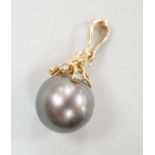 A modern 585 yellow metal, single stone Tahitian pearl and five stone diamond chip set pendant,