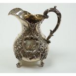 A Victorian embossed silver baluster cream jug, Robert Harper, London, 1862, height 15.1cm, 8.6oz.