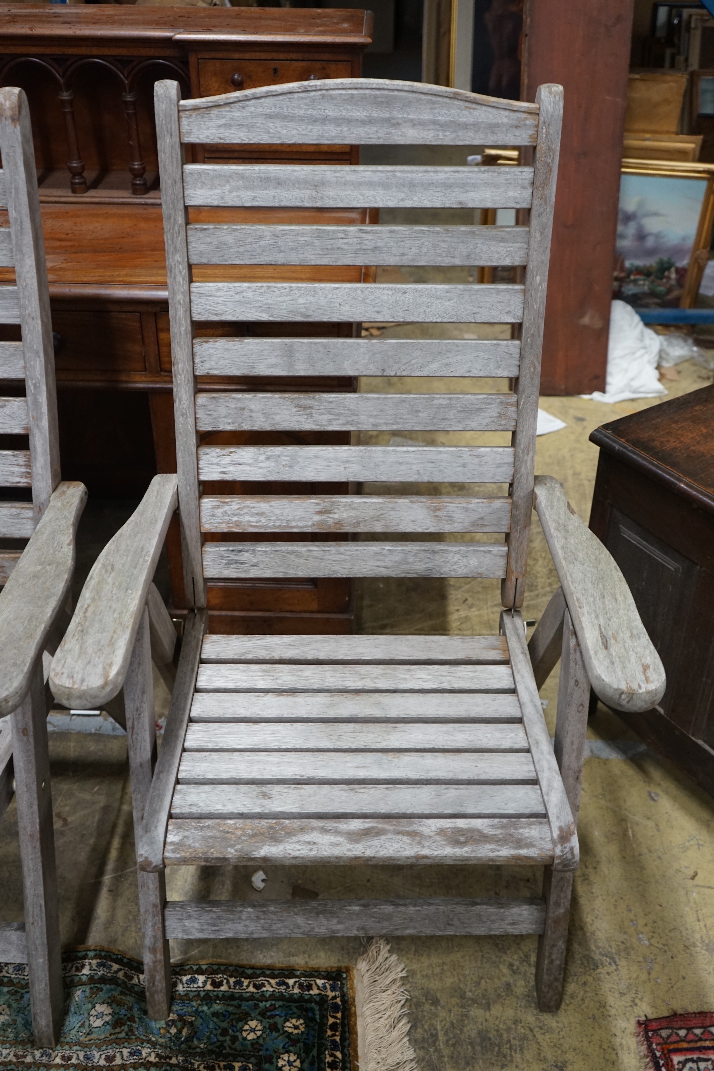 A pair of weathered teak folding garden armchairs, height 112cm - Image 2 of 3