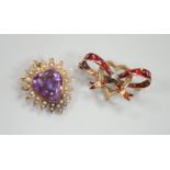 An early 20th century yellow metal amethyst and seed peart set heart shaped pendant brooch, 25mm,