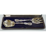 A cased pair of American sterling silver fruit servers, spoon 21.7cm, 4.4oz.