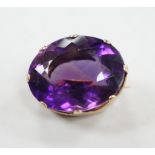 A modern 9ct gold mounted oval facet cut amethyst brooch, 22mm, gross weight 8.5 grams.