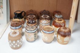 A quantity of Doulton stoneware tobacco jars and jugs