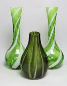 A pair of tall Murano green and white swirled glass vases and another Murano glass vase, tallest