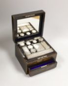 A late Victorian Mappin & Webb coromandel wood toilet box, containing ten silver mounted toilet