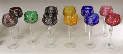 A set of eleven cut and coloured hock glasses