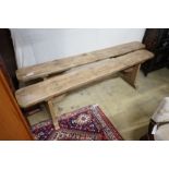 A pair of 19th century provincial pine benches, length 179cm, depth 22cm, height 47cm