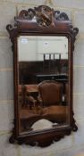 A George III style mahogany fret cut wall mirror, with gilt carved eagle surmount, width 56cm,
